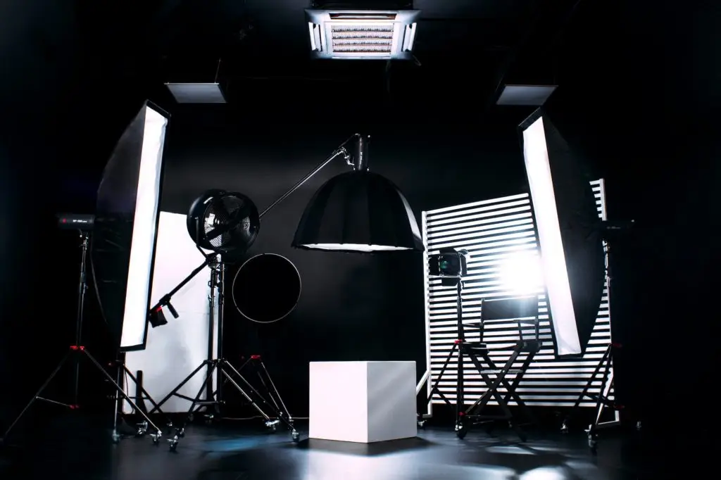 Modern photo studio with professional equipment. Black cyclorama.